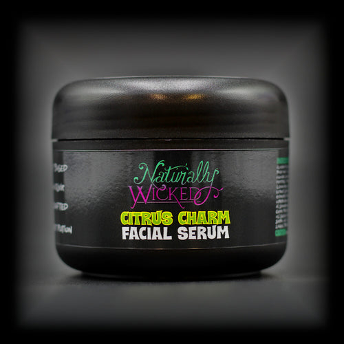 Naturally Wicked Citrus Charm Facial Serum in a sleek black jar with bold neon lettering. A handcrafted potion designed to bring a fresh, zesty glow to your skin
