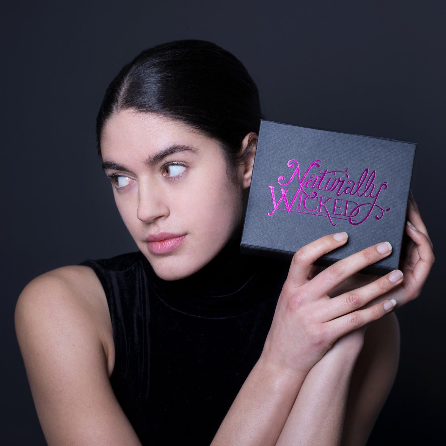 Naturally Wicked Original 3 Step Beauty Kit In Hands Of Dark Haired Beautiful Lady