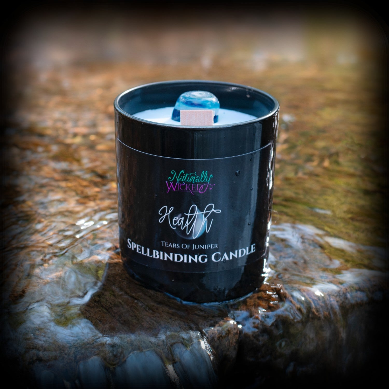 Naturally Wicked Spellbinding Friendship Spell Candle Beside Purple & Green Cocktails In Mystical Darkness