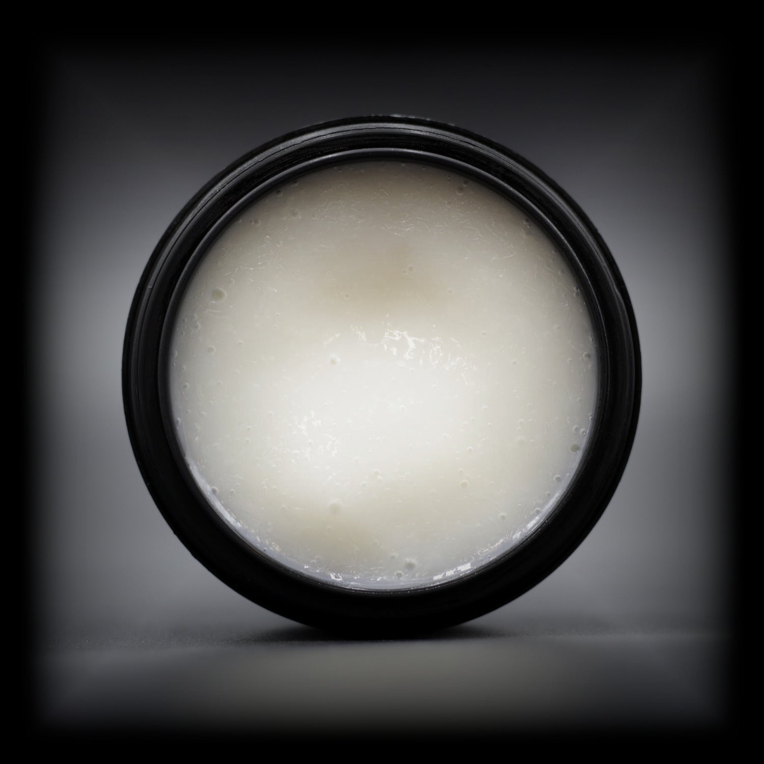 Top view of Naturally Wicked Citrus Charm Facial Serum, showing smooth, creamy texture.