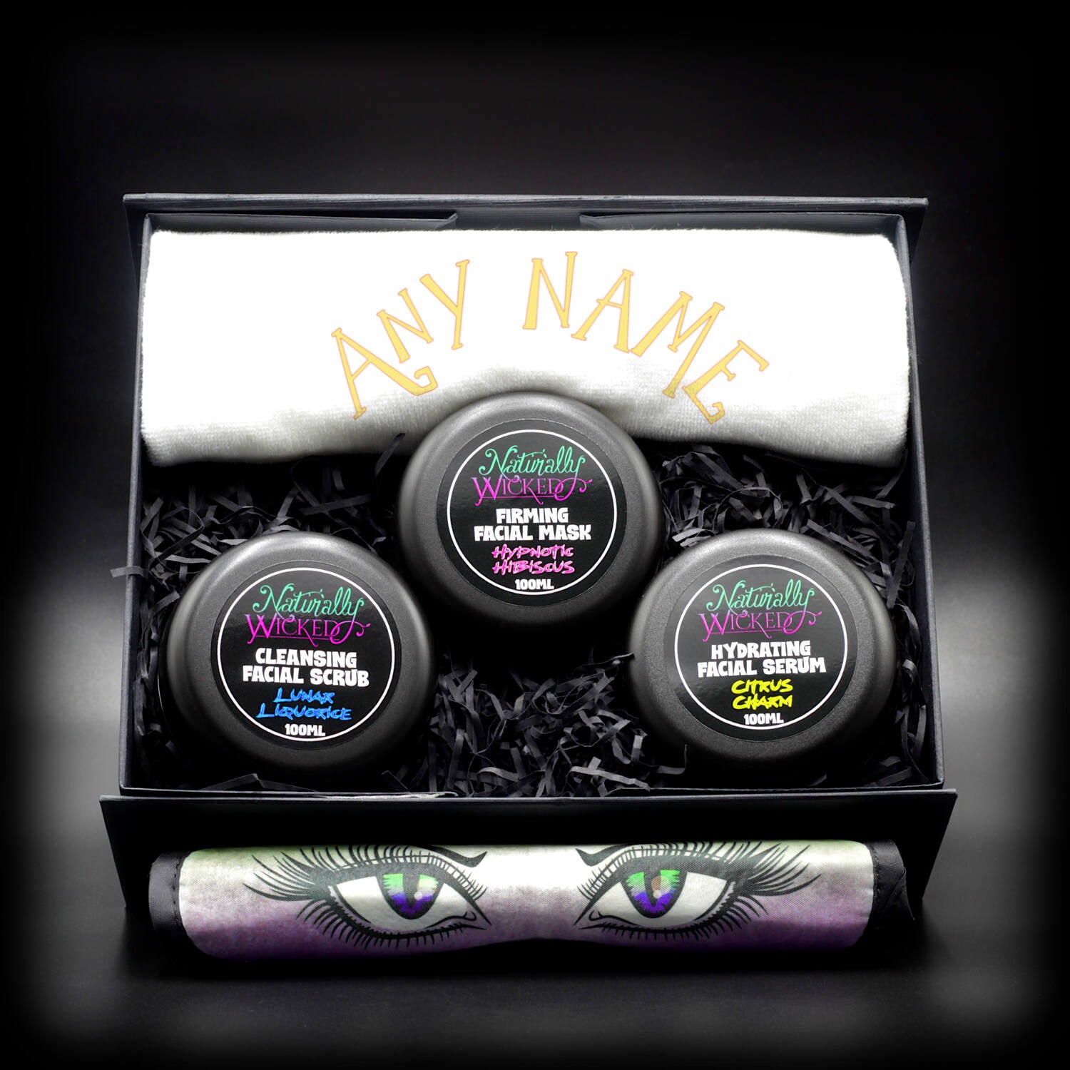 Naturally Wicked personalized skincare gift set with Cleansing Facial Scrub, Firming Facial Mask, Hydrating Facial Serum, custom towel, and eye mask.