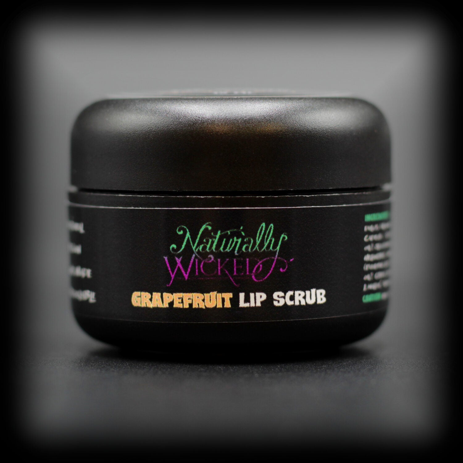 Naturally Wicked Grapefruit Lip Scrub With Natural & Vegan Ingredients In Luxury Black Container On Dark Background