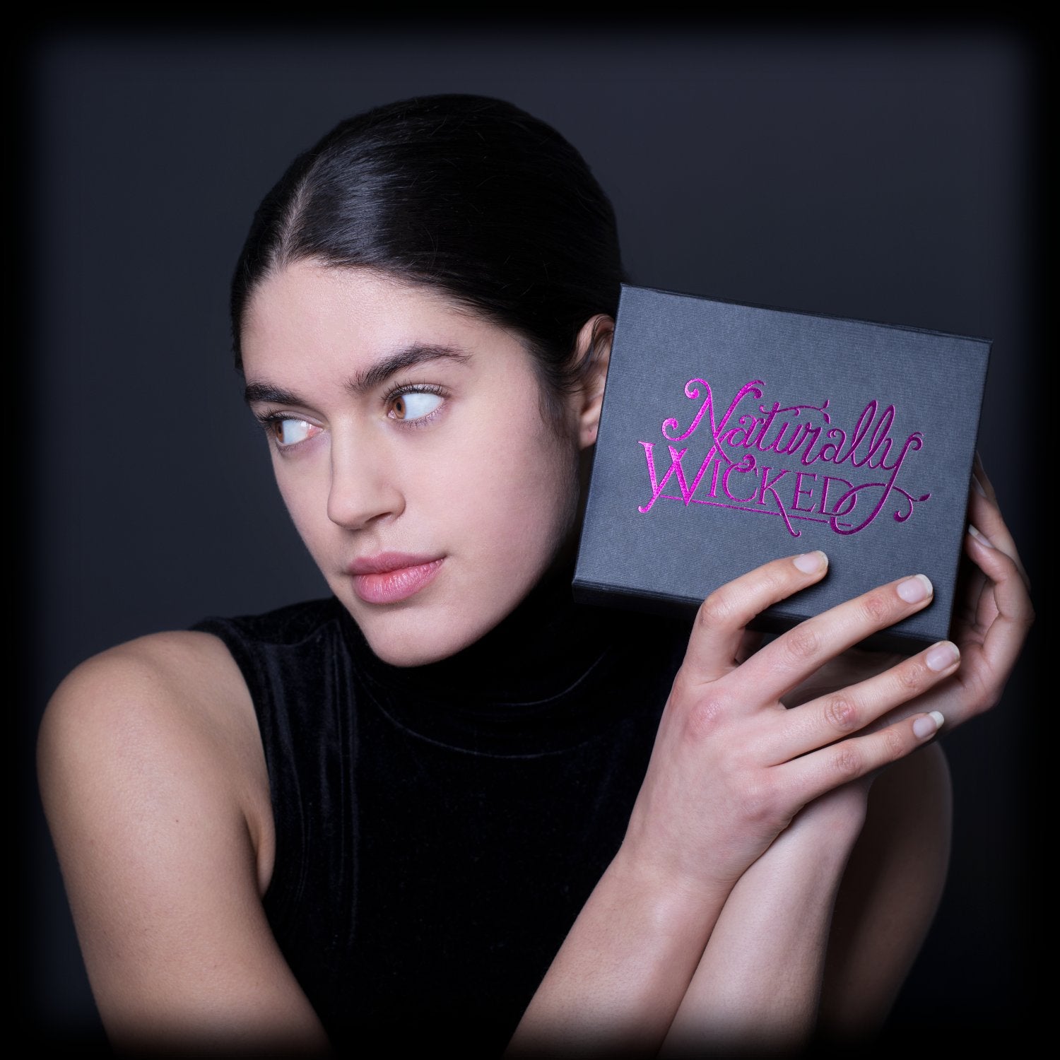 Brunette Model Holding Naturally Wicked 3 Step Hand And Foot Kit 