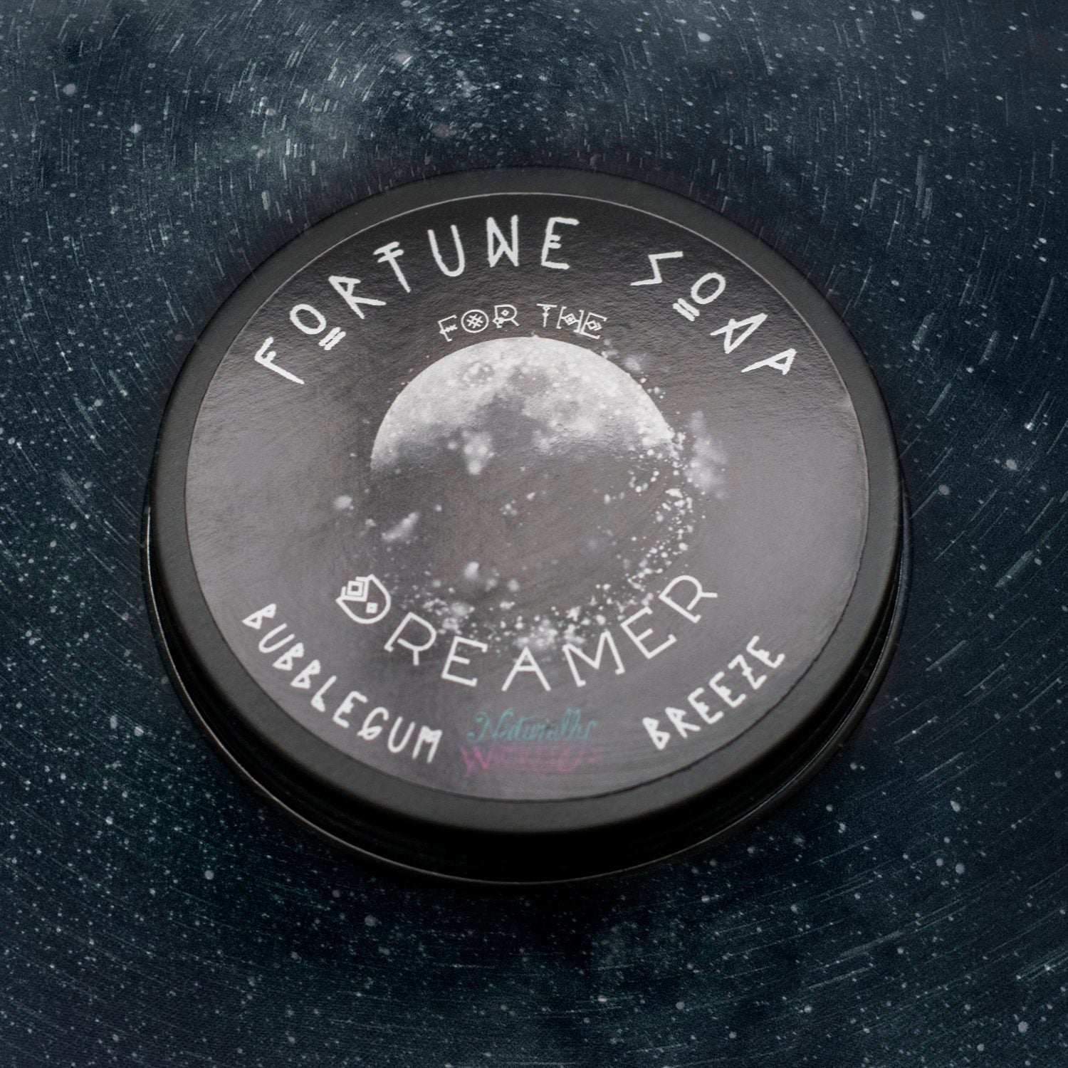 Naturally Wicked Fortune Soap For The Dreamer black container with text and moon graphic on a dark, starry, textured background
