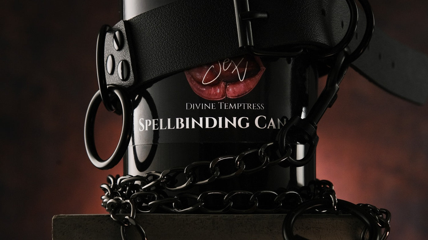 Naturally Wicked Spellbinding Sex Candle In Erotic Scene Surrounded By Handcuffs, Sensual Crystal, Whip & Pink Bed Covers