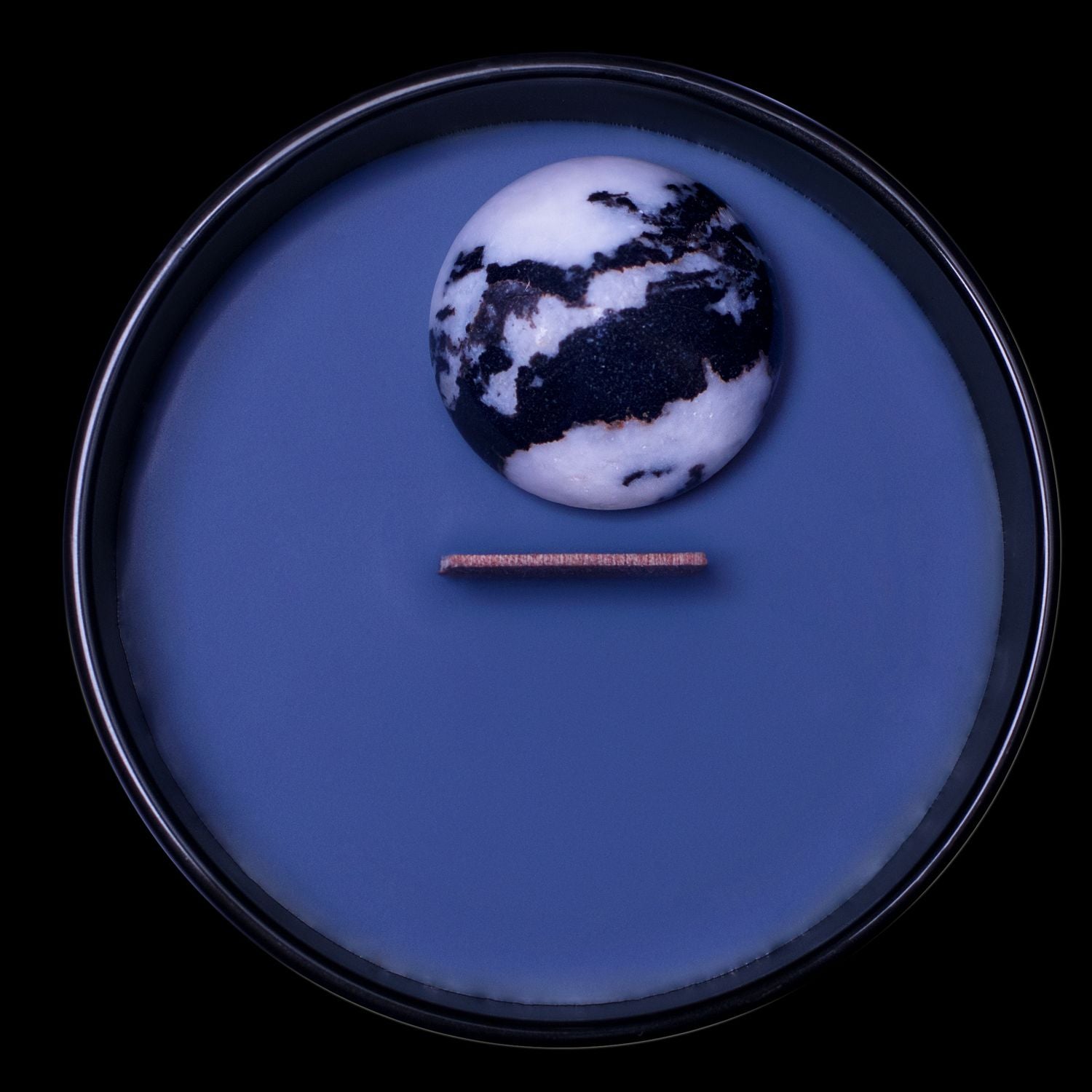 Birds Eye View Of The Naturally Wicked Hypnotwist Achieve Candle Featuring Plant-based Soy Black Wax scented with Blackjack Breeze & Includes A Zebra Jasper Crystal Spinning Top & Wooden Wick