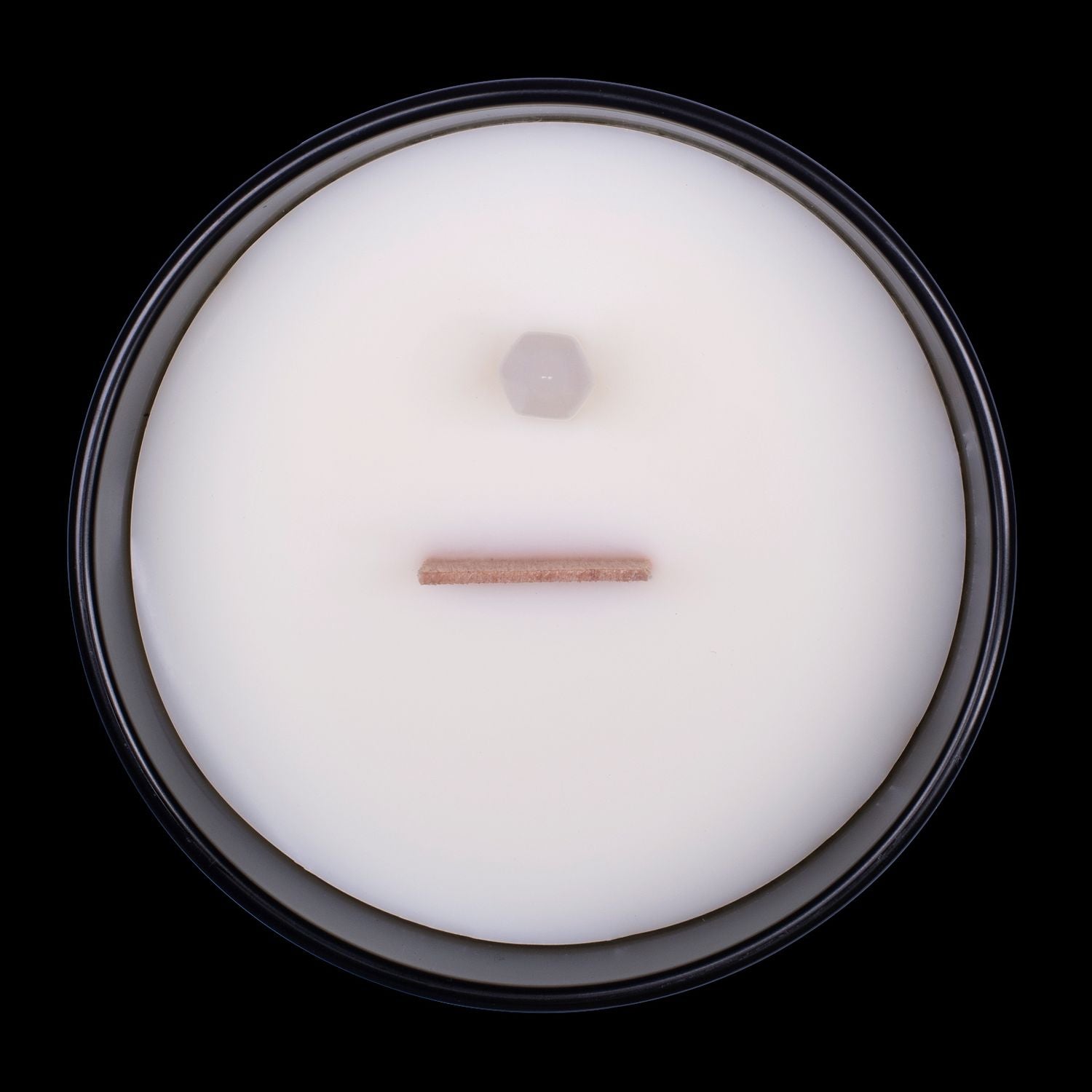 Naturally Wicked Voodoo Healing Crystal Candle View From Above Shows White Smooth Plant-based Wax, Featuring A Wooden Wick And Clear Quartz Crystal Wand. All Situated Within A Black Gloss Glass Container.