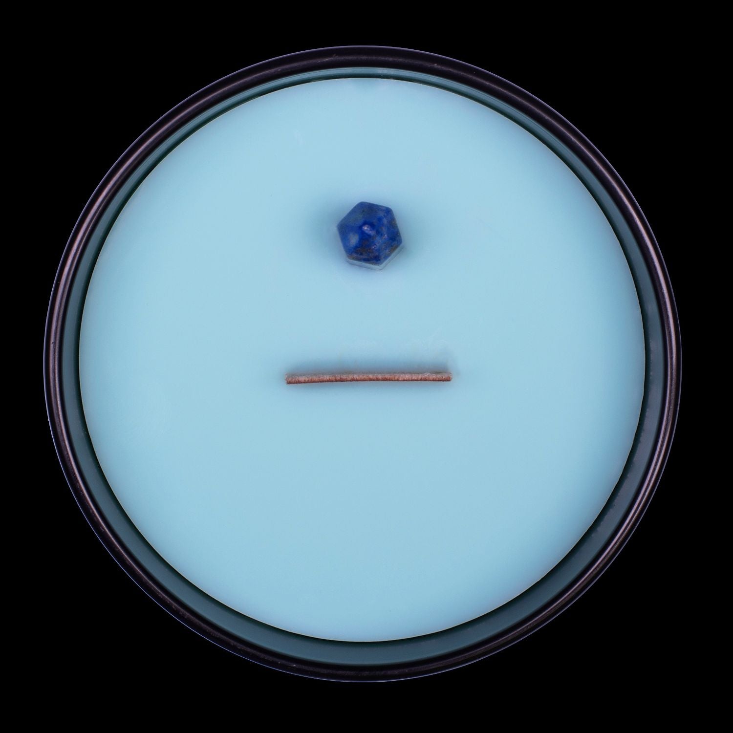 Naturally Wicked Voodoo Romance Crystal Candle View From Above Shows Blue Smooth Plant-based Wax, Featuring A Wooden Wick And Blue Lapis Lazuli Crystal Wand. All Situated Within A Black Gloss Glass Container.