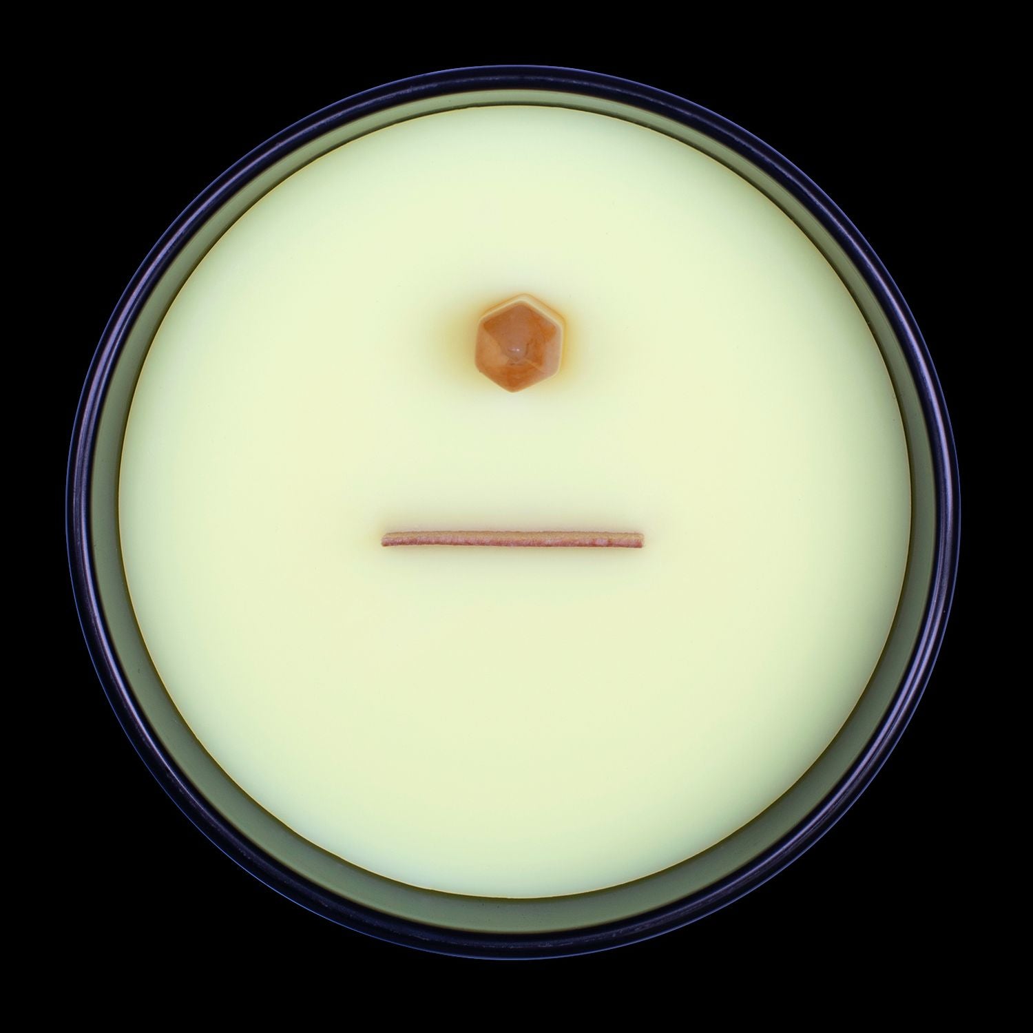 Naturally Wicked Voodoo Success Crystal Candle View From Above Shows Yellow Smooth Plant-based Wax, Featuring A Wooden Wick And Yellow Jade Crystal Wand. All Situated Within A Black Gloss Glass Container.