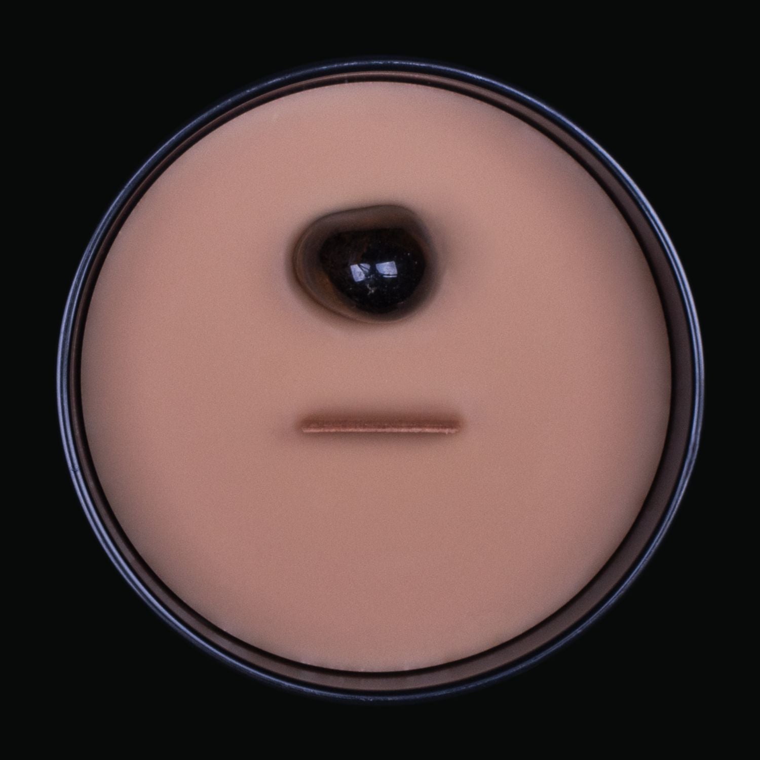 Naturally Wicked Spellbinding Courage Crystal Candle View From Above Shows Brown Smooth Plant-based Wax, Featuring A Wooden Wick And Tiger's Eye Spell Crystal. All Situated Within A Black Gloss Glass Container. A Perfect Gift For Any Occasion