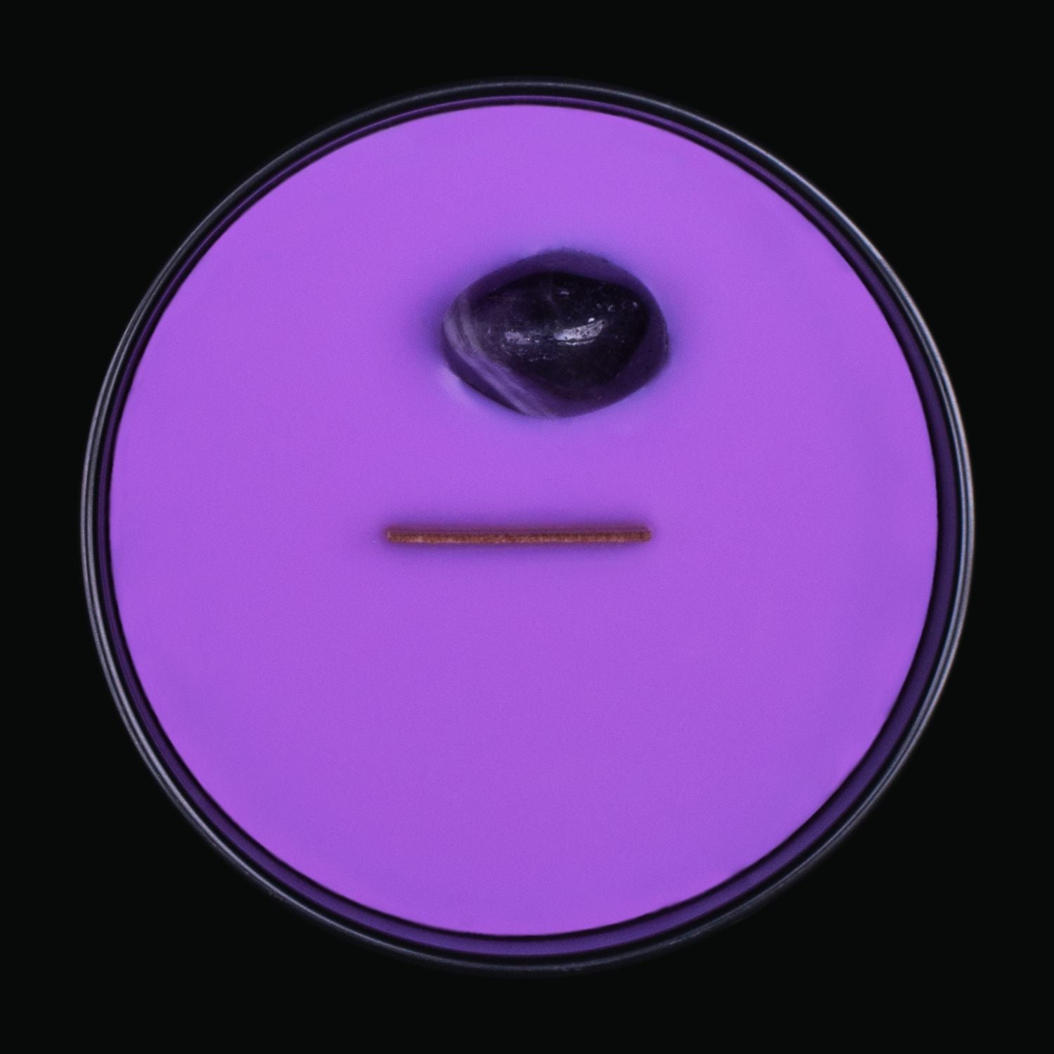 Naturally Wicked Spellbinding Family Crystal Candle View From Above Shows Purple Smooth Plant-based Wax, Featuring A Wooden Wick And Purple Agate Spell Crystal. All Situated Within A Black Gloss Glass Container. A Heartwarming Gift For A Loved One