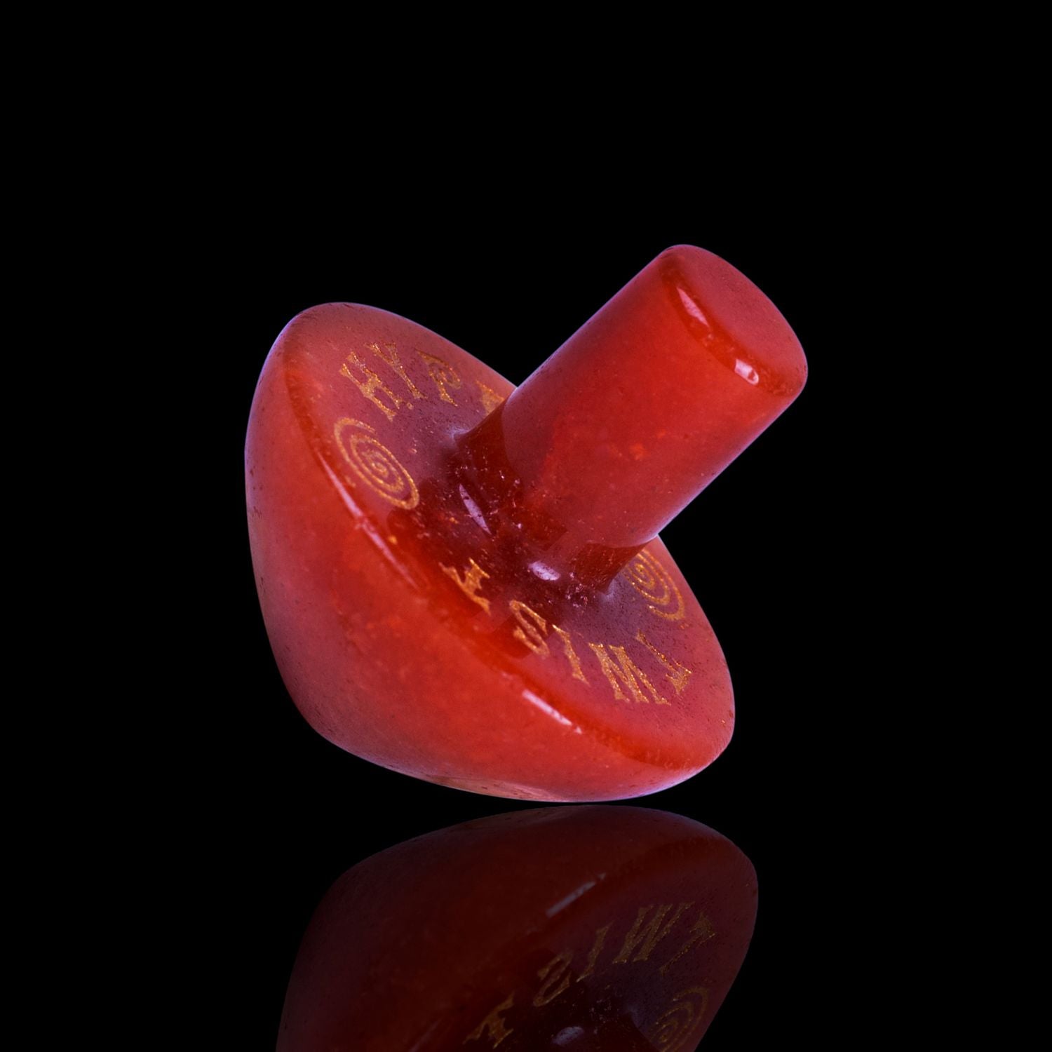 Naturally Wicked Exclusive Hypnotwister. An Orange Aventurine Crystal Spinning Top Engraved With Hypno Twist