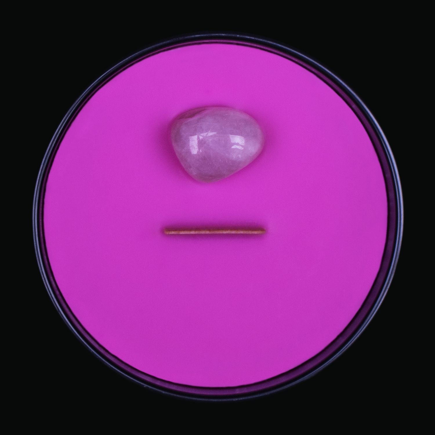 Naturally Wicked Spellbinding Love Crystal Candle View From Above Shows Pink Smooth Plant-based Wax, Featuring A Wooden Wick And Rose Quartz Spell Crystal. All Situated Within A Black Gloss Glass Container. The Perfect Lover Gift