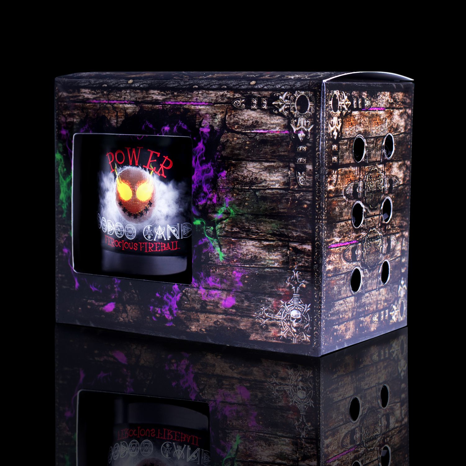 Side View Of The Fabulously Haunting Voodoo Power Spell Candle. Naturally Wicked Voodoo Power Candle Displayed In A Gift Box. The Candle Features Plant-Based Smooth Red Wax, A Wood Wick, Red Voodoo Doll And A Beautiful Red Jasper Crystal Wand.